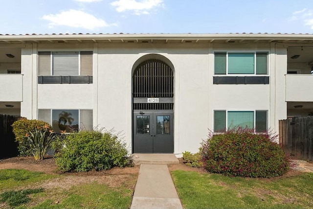 view of building exterior featuring fence