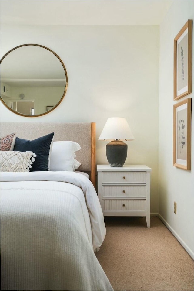 carpeted bedroom with baseboards