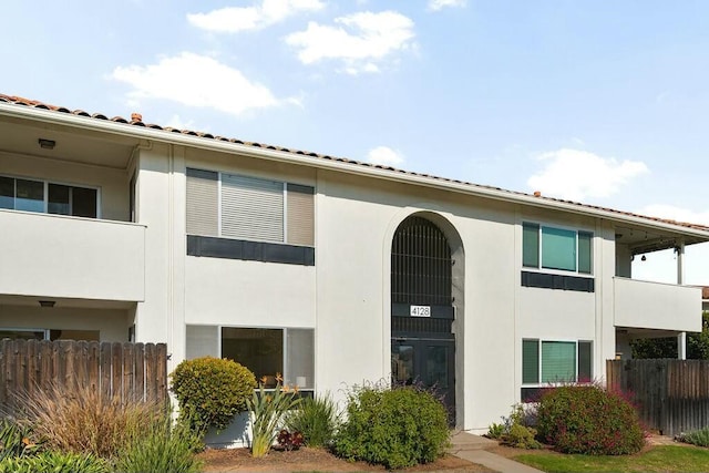 view of building exterior featuring fence