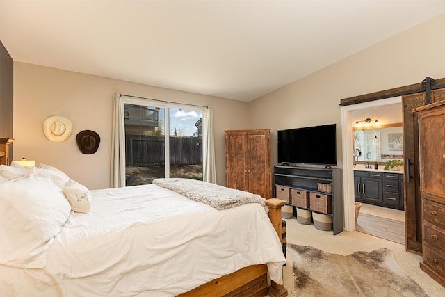 bedroom featuring ensuite bathroom, access to outside, and light colored carpet