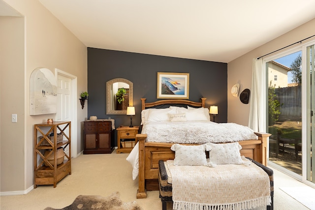 bedroom with baseboards, access to outside, and light colored carpet