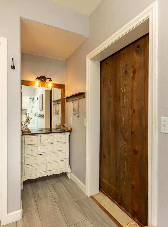 bathroom featuring vanity and baseboards