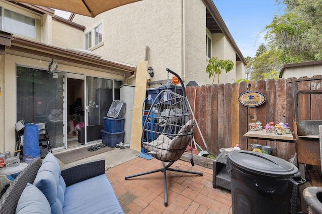 view of patio / terrace featuring fence