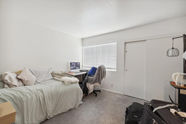 carpeted bedroom featuring a closet