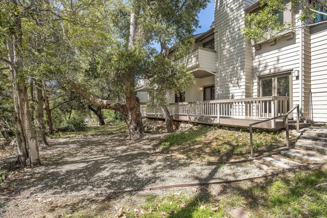 view of yard featuring a wooden deck