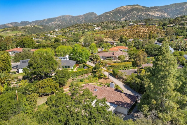 birds eye view of property with a mountain view