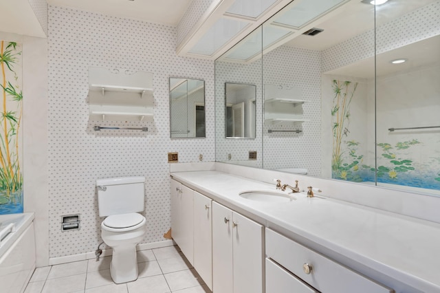 bathroom featuring a bathing tub, visible vents, toilet, tile patterned floors, and vanity