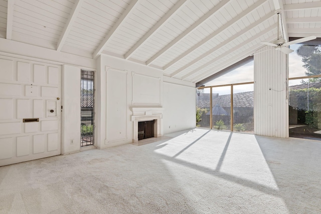 unfurnished living room featuring a mountain view, a ceiling fan, high vaulted ceiling, and carpet floors