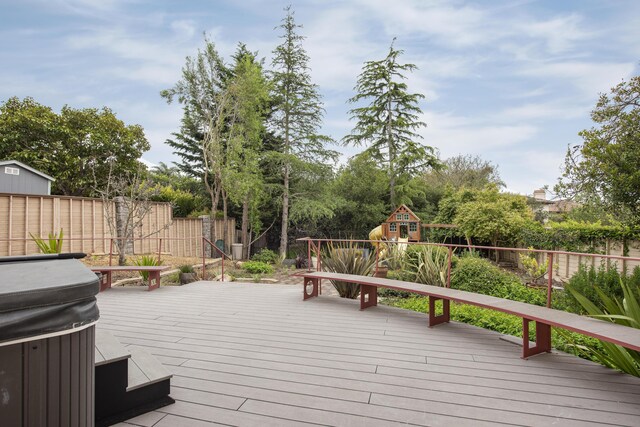 wooden deck featuring a fenced backyard