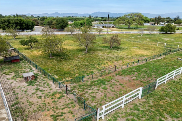 drone / aerial view with a mountain view and a rural view