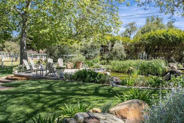 view of yard featuring a patio and fence