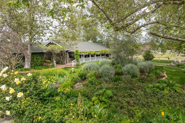 exterior space featuring a chimney and fence