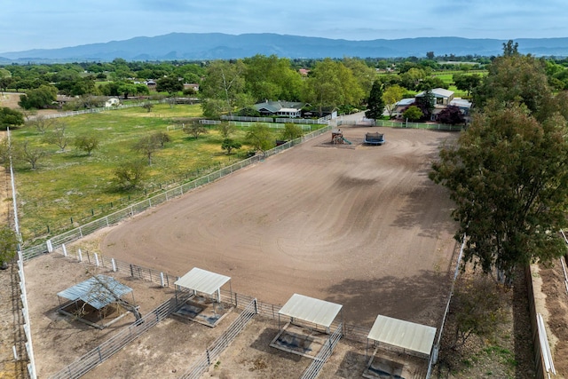 birds eye view of property featuring a mountain view and a rural view