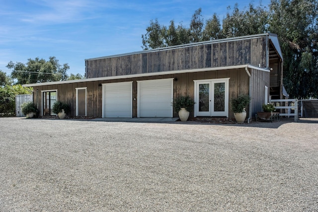 exterior space featuring a garage and fence