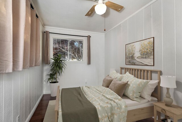 bedroom with ceiling fan and dark wood-type flooring