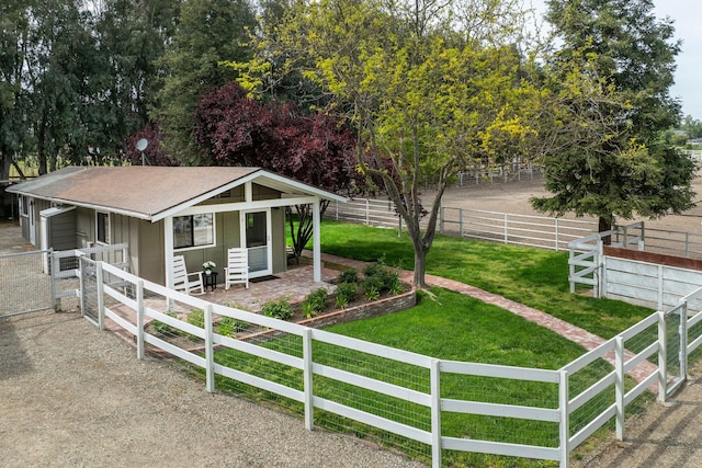 view of front of home with roof with shingles and an exterior structure