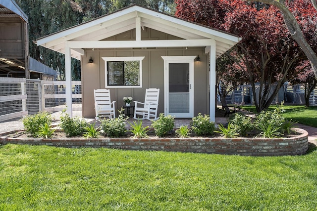 view of outbuilding with fence