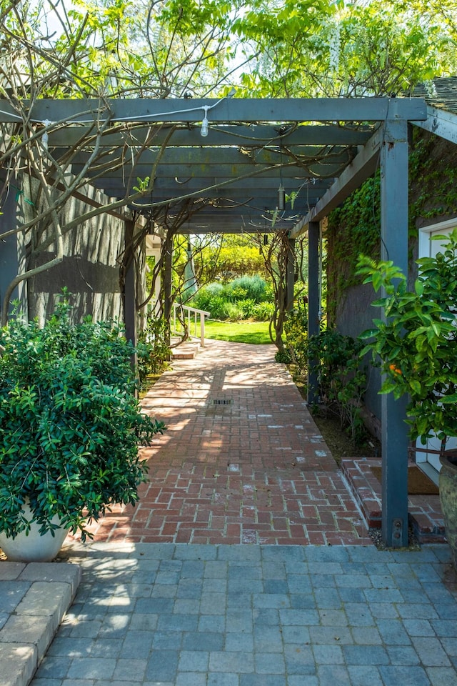 view of home's community featuring a pergola