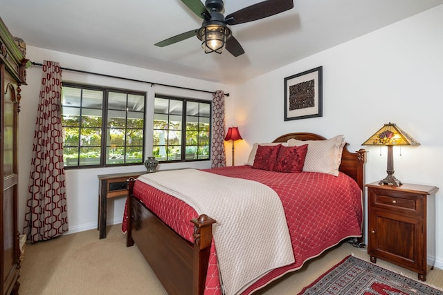 bedroom with baseboards, a ceiling fan, and carpet floors