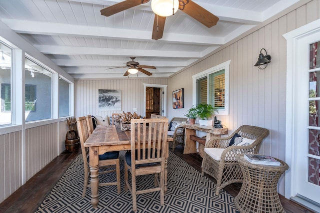 sunroom with beam ceiling and a ceiling fan
