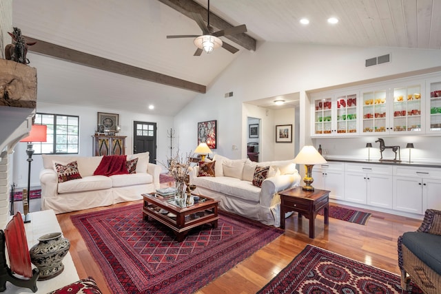 living area with recessed lighting, light wood-type flooring, beam ceiling, visible vents, and a ceiling fan
