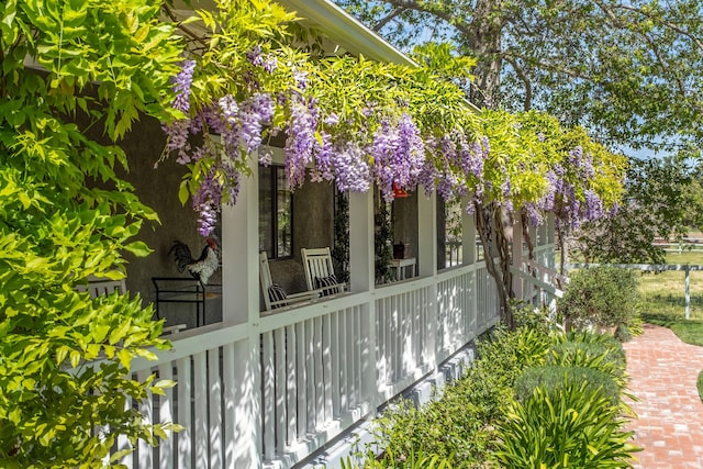 view of side of property with a porch