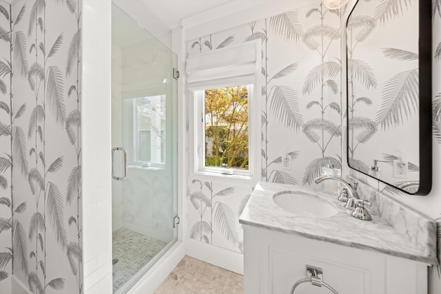 full bathroom with a stall shower and vanity