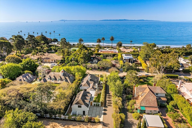 birds eye view of property with a water view and a residential view