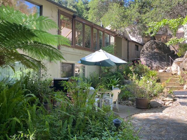 1040 Mission Canyon Rd, Santa Barbara, CA 93105 - view of side of home with a patio and stucco siding
