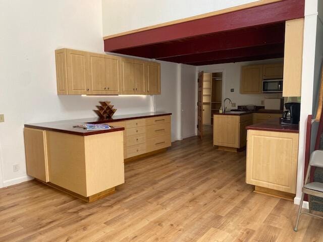 1040 Mission Canyon Rd, Santa Barbara, CA 93105 - kitchen featuring a sink, black microwave, beam ceiling, light brown cabinetry, and dark countertops