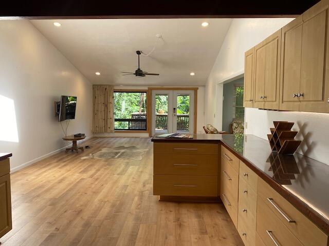 1040 Mission Canyon Rd, Santa Barbara, CA 93105 - kitchen with vaulted ceiling, ceiling fan, light wood-type flooring, a peninsula, and recessed lighting