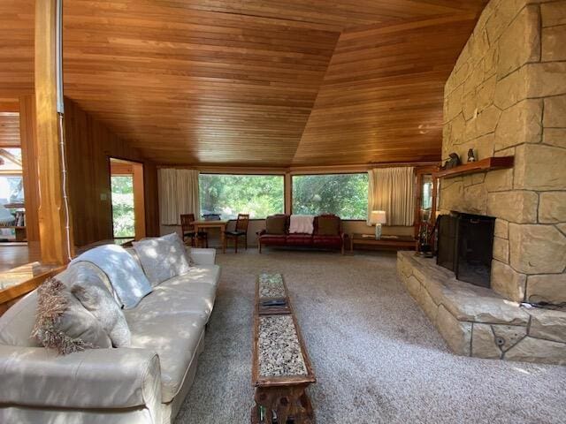 1040 Mission Canyon Rd, Santa Barbara, CA 93105 - living area with wood ceiling, vaulted ceiling, carpet, a fireplace, and wooden walls