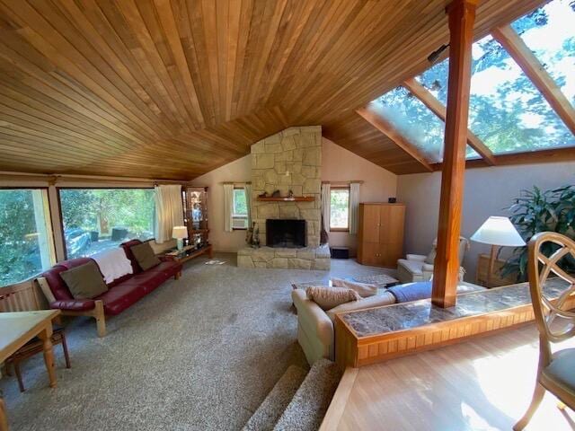 1040 Mission Canyon Rd, Santa Barbara, CA 93105 - carpeted living room with a skylight, vaulted ceiling, wooden ceiling, and a fireplace