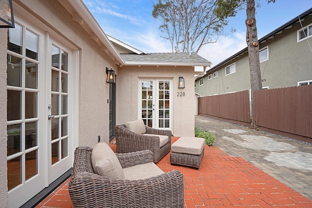 view of patio / terrace with fence and french doors