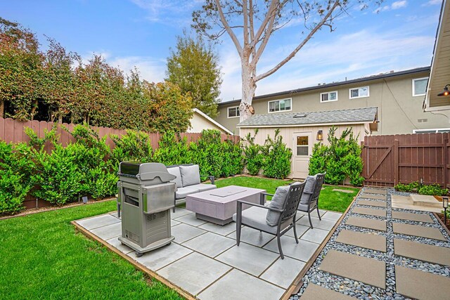 view of patio / terrace with a fenced backyard, a grill, and outdoor lounge area