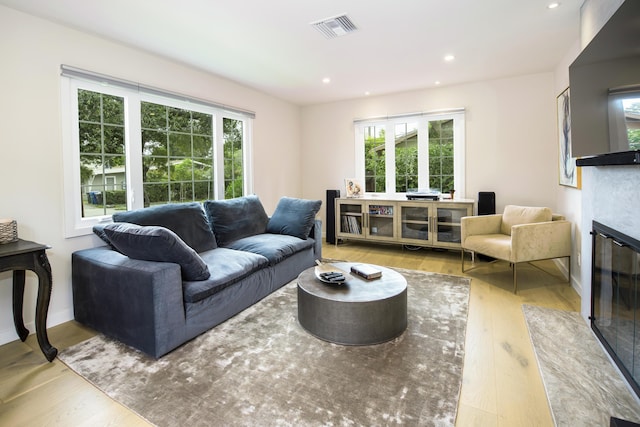 228 W Mission St, Santa Barbara, CA 93101 - living room with wood finished floors, a fireplace with flush hearth, and recessed lighting