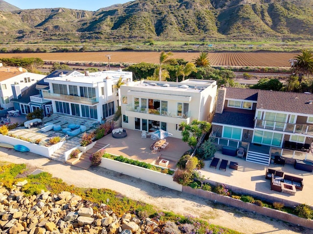 drone / aerial view featuring a mountain view