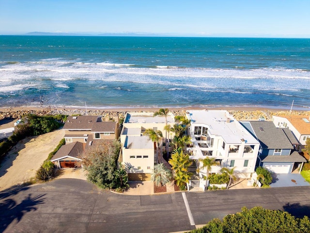 aerial view with a water view, a residential view, and a view of the beach