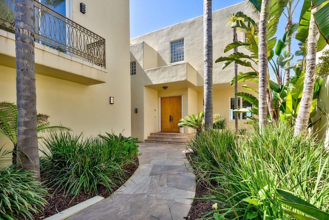 doorway to property with stucco siding