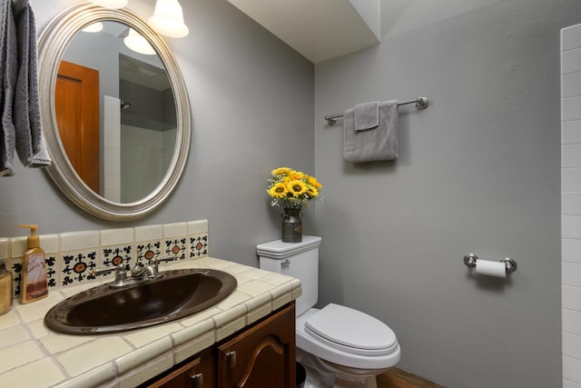 bathroom featuring toilet and vanity