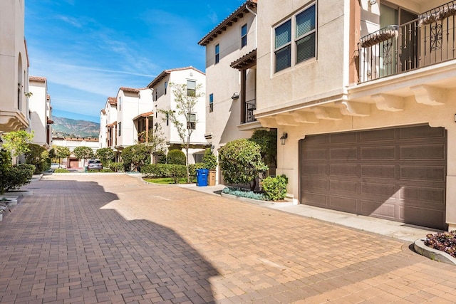 view of home's community with an attached garage