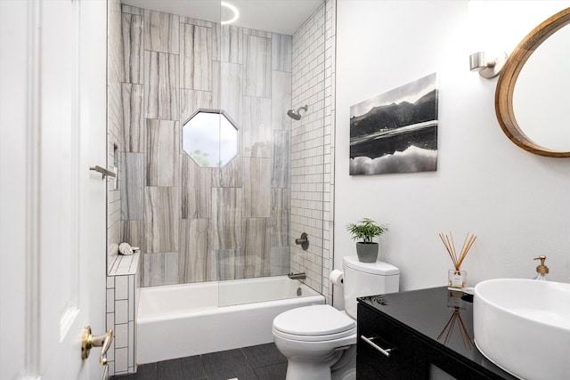 full bathroom featuring toilet, shower / bath combination, and vanity