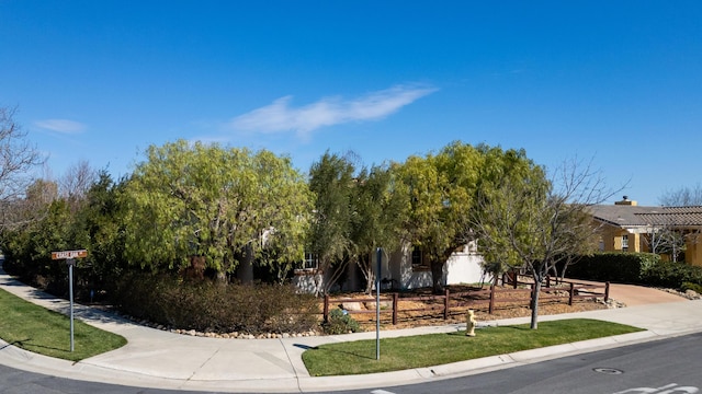 view of front of house with fence