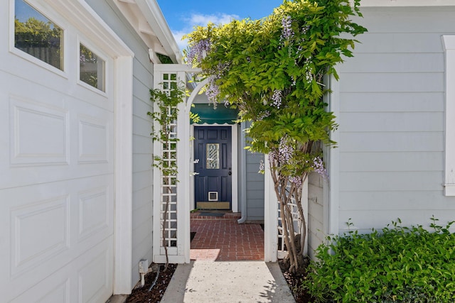 doorway to property featuring a garage