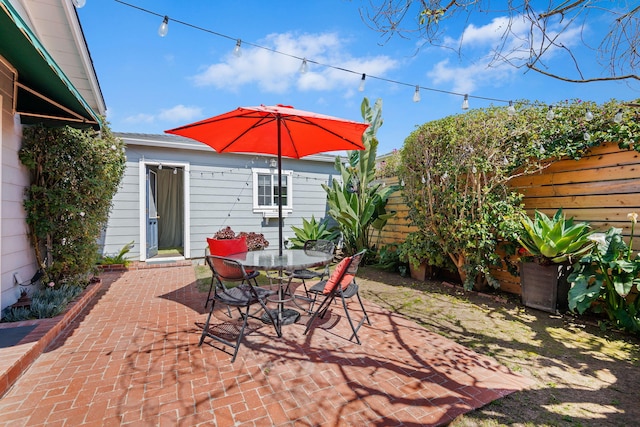 view of patio / terrace with fence and outdoor dining space
