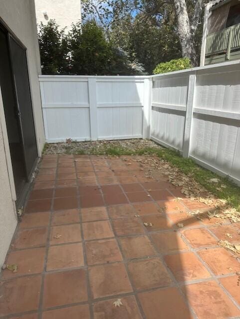 view of patio / terrace featuring fence