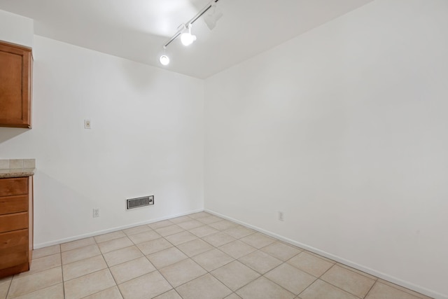 39 Dearborn Pl Unit 95, Goleta, CA 93117 - unfurnished dining area featuring rail lighting and baseboards