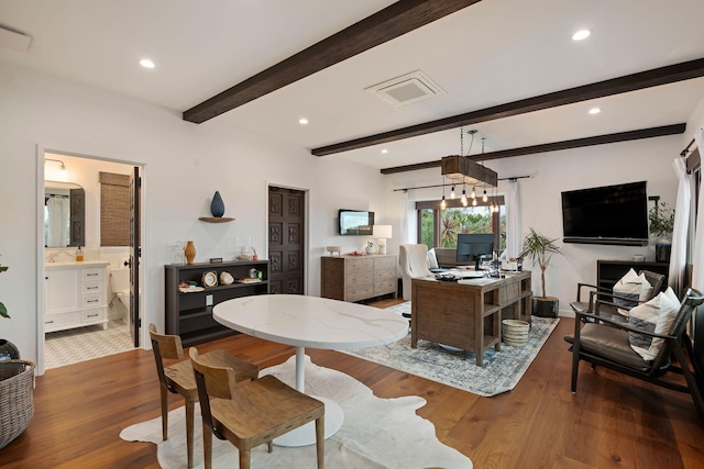interior space featuring recessed lighting, beamed ceiling, and wood finished floors