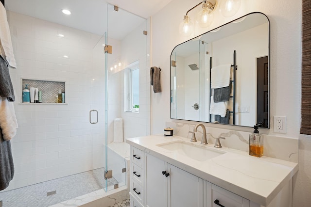 bathroom with vanity, a stall shower, and recessed lighting