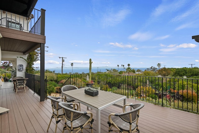 wooden deck with outdoor dining area